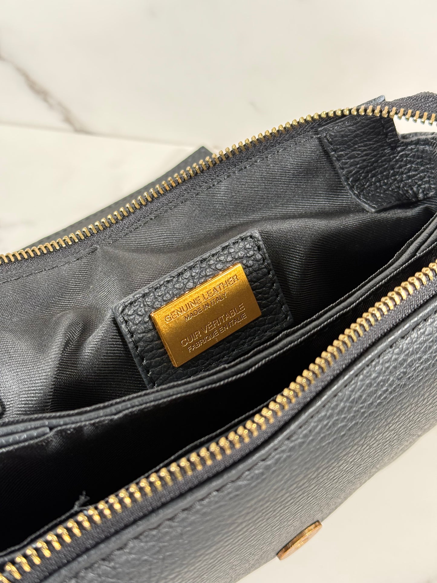 Cartera de mano 100% cuero