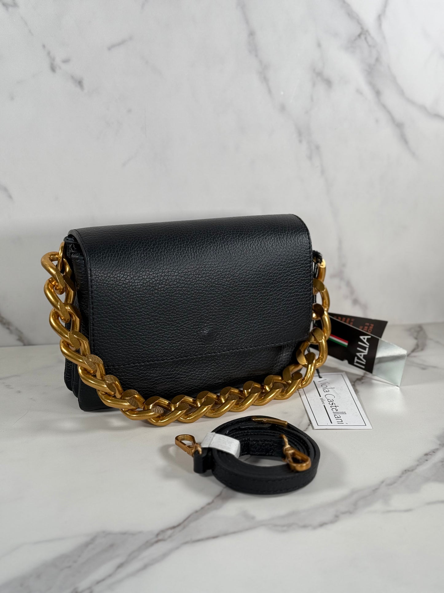 Cartera de mano 100% cuero