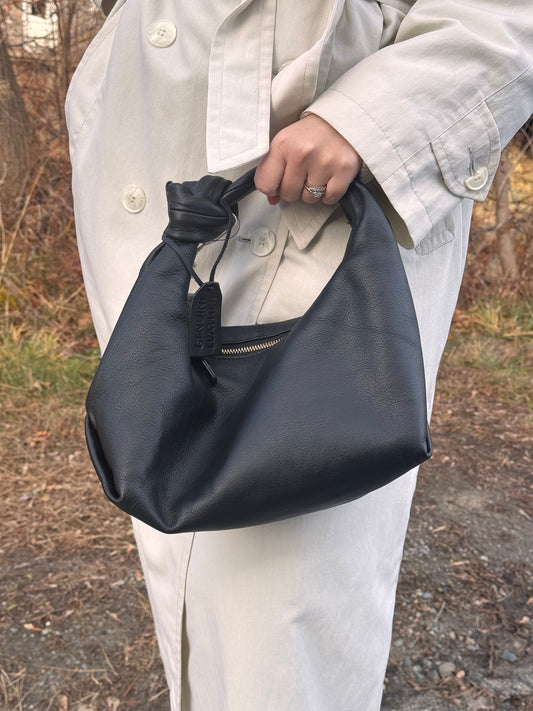 Cartera de mano 100% cuero